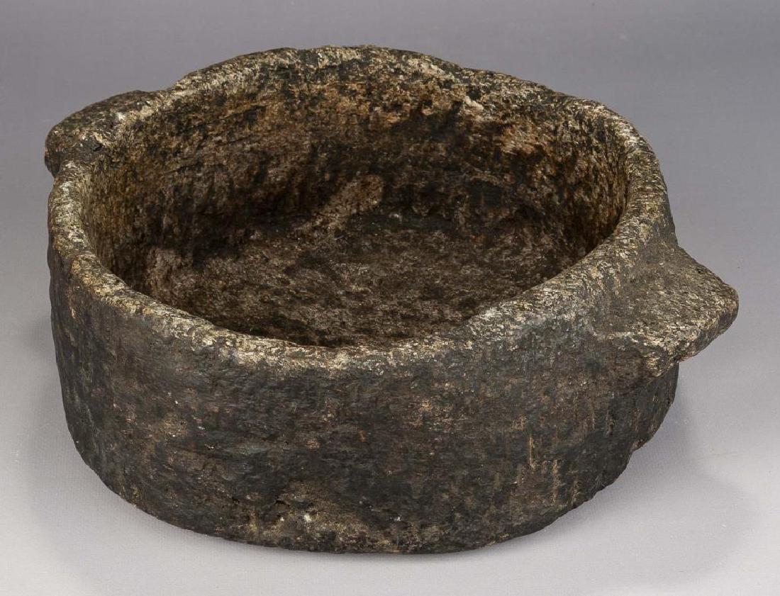 Eastern Woodlands Soapstone Bowl: DESCRIPTION: Eastern Woodlands two-handles bowl of micaceous soapstone. MEASUREMENTS: 10-1/2" diameter x 4-3/4" high. CONDITION: No defects noted.