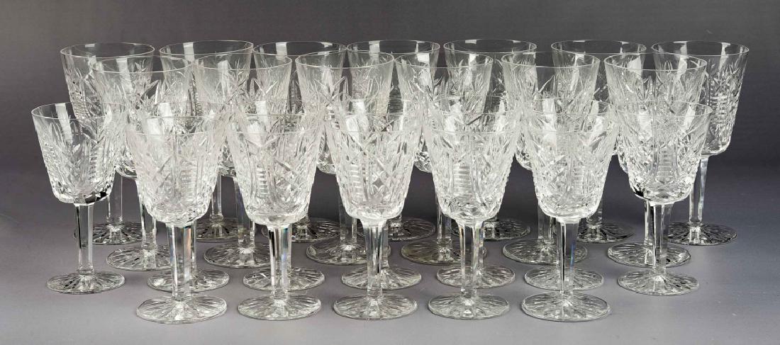 25 Pcs Waterford Clare Crystal Stemware: DESCRIPTION: Twenty-five pieces Waterford crystal stemware in the Clare pattern. Acid marked to bottom. Includes eleven 6-7/8" water goblets and fourteen 5-7/8" claret wine glasses. MEASUREMENTS: See 