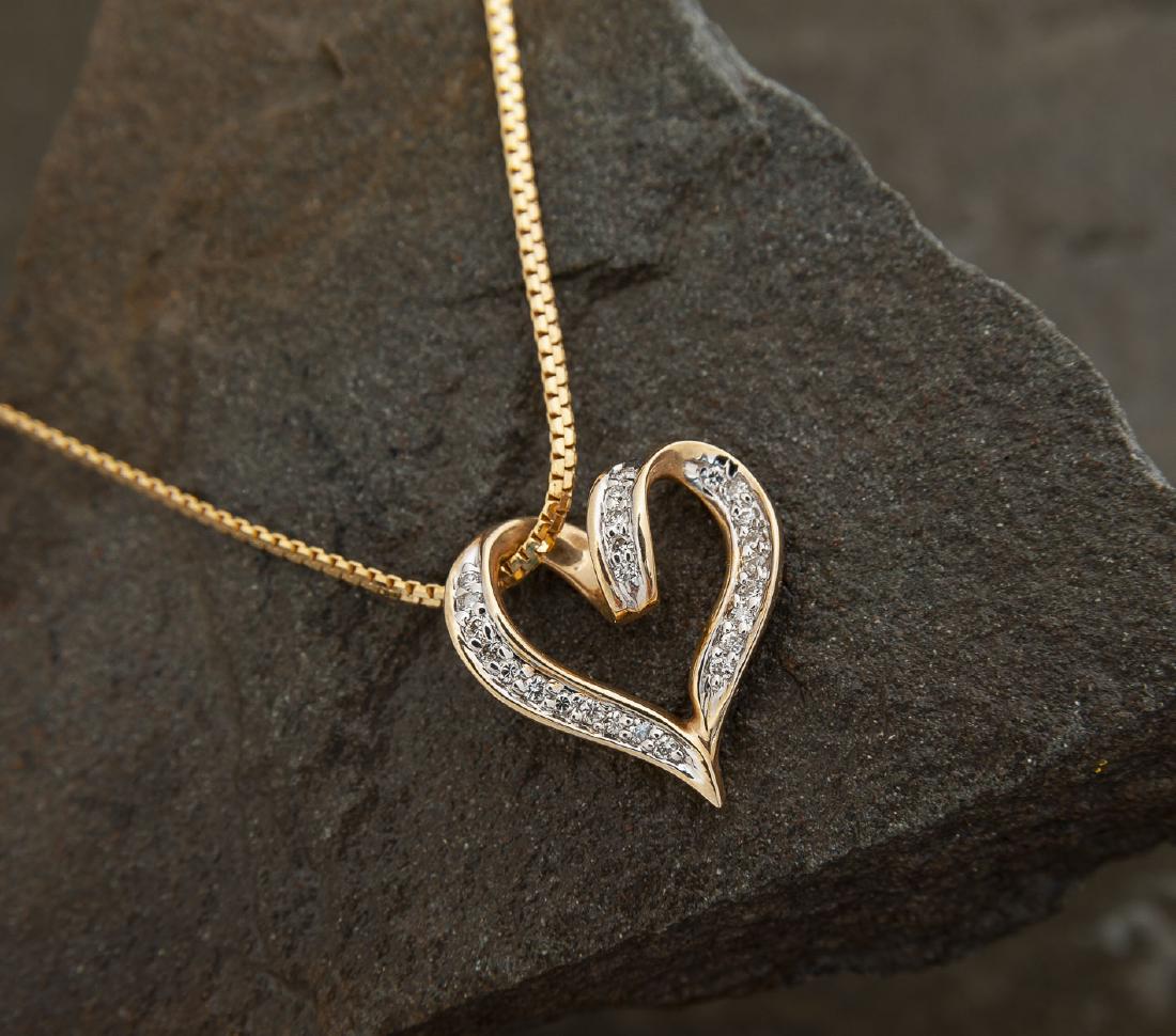 14K .20 CTW Diamond Heart Pendant on Chain: DESCRIPTION: 14k stamped heart pendant set with .20 CTW diamonds on 14k Italian chain stamped 585. MEASUREMENTS: 3.4 dwt (5.3 gr). Pendant 3/4", chain 16". CONDITION: No defects noted.