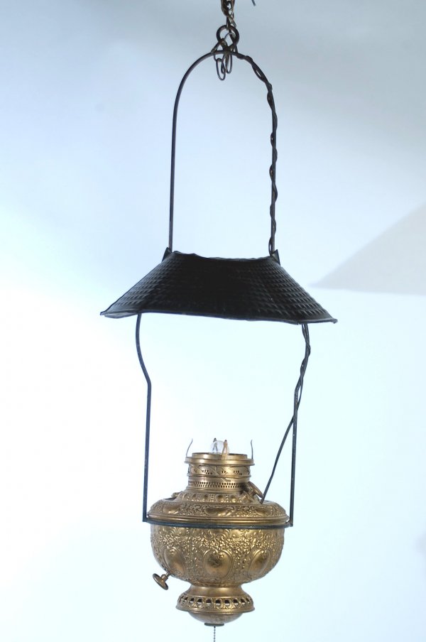19th C Rochestor Country Store Hanging Lamp: DESCRIPTION: Late 19th century country store hanging kerosene lamp, embossed brass font, cast iron frame with black painted tin shade, marked "The New Rochestor Made in U.S.A.". MEASUREMENTS: 38". CON