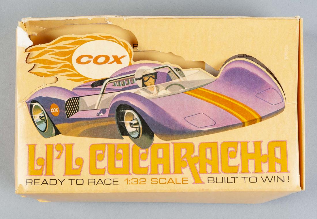 Cox L'il Cucaracha 1/32 Slot Car in OB: DESCRIPTIONL: Cox L'il Cucaracha 1/32 slot car in original box with paperwork. Purple with driver and decals. CONDITION: Not tested. Toning to box.