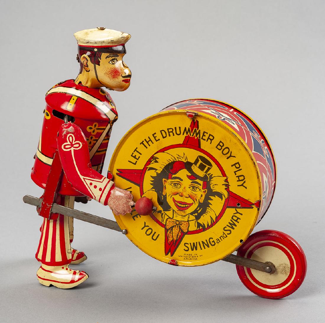Marx George the Drummer Wind Up Toy: DESCRIPTION: Marx George the Drummer Boy tin litho wind up toy. MEASUREMENTS: 8" long x 8" high. CONDITION: Runs. Minimal wear to paint.