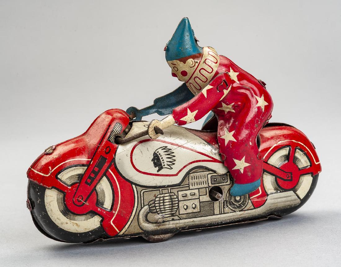 Tin Litho Clown on Motorcycle Wind Up Toy: DESCRIPTION: Tin litho clown on motorcycle wind up toy. Made in Japan. MEASUREMENTS: 5-1/2". CONDITION: Wear including scratches and losses. Works.