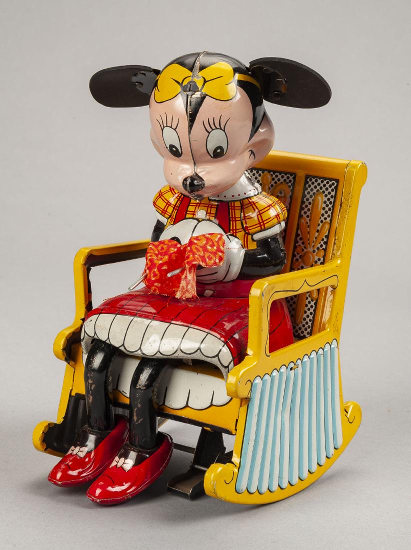 Linemar Knitting Minnie in Rocking Chair: DESCRIPTION: Linemar knitting Minnie in rocking chair. MEASUREMENTS: 7" high. CONDITION: Minimal paint losses. Works.