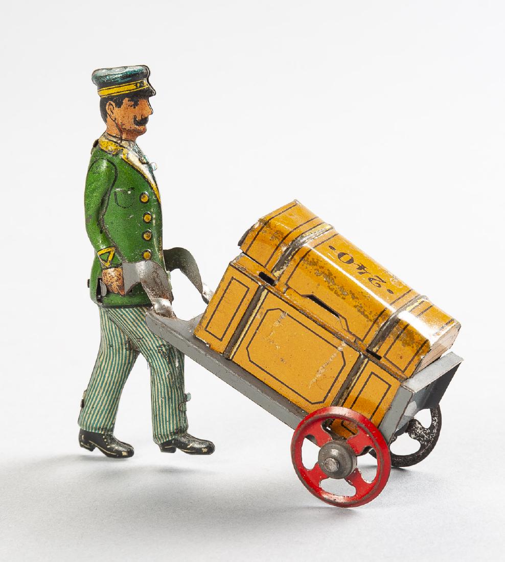 Penny Toy Tin Litho Bell Hop with Luggage: DESCRIPTION: Penny Toy tin litho bell hop with luggage and cart. Luggage marked 240. MEASUREMENTS: 3" high. CONDITION: Wear includes scratches and scuffs.