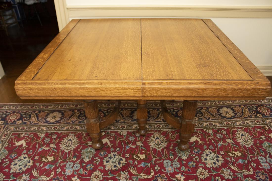 Antique Oak Dining Table: DESCRIPTION: Antique oak dining table with tambour extensions. Original finish, circa 1900. MEASUREMENTS: Open 77-1/2" x 44" x 29". Closed 49-3/4" x 43-1/2".
