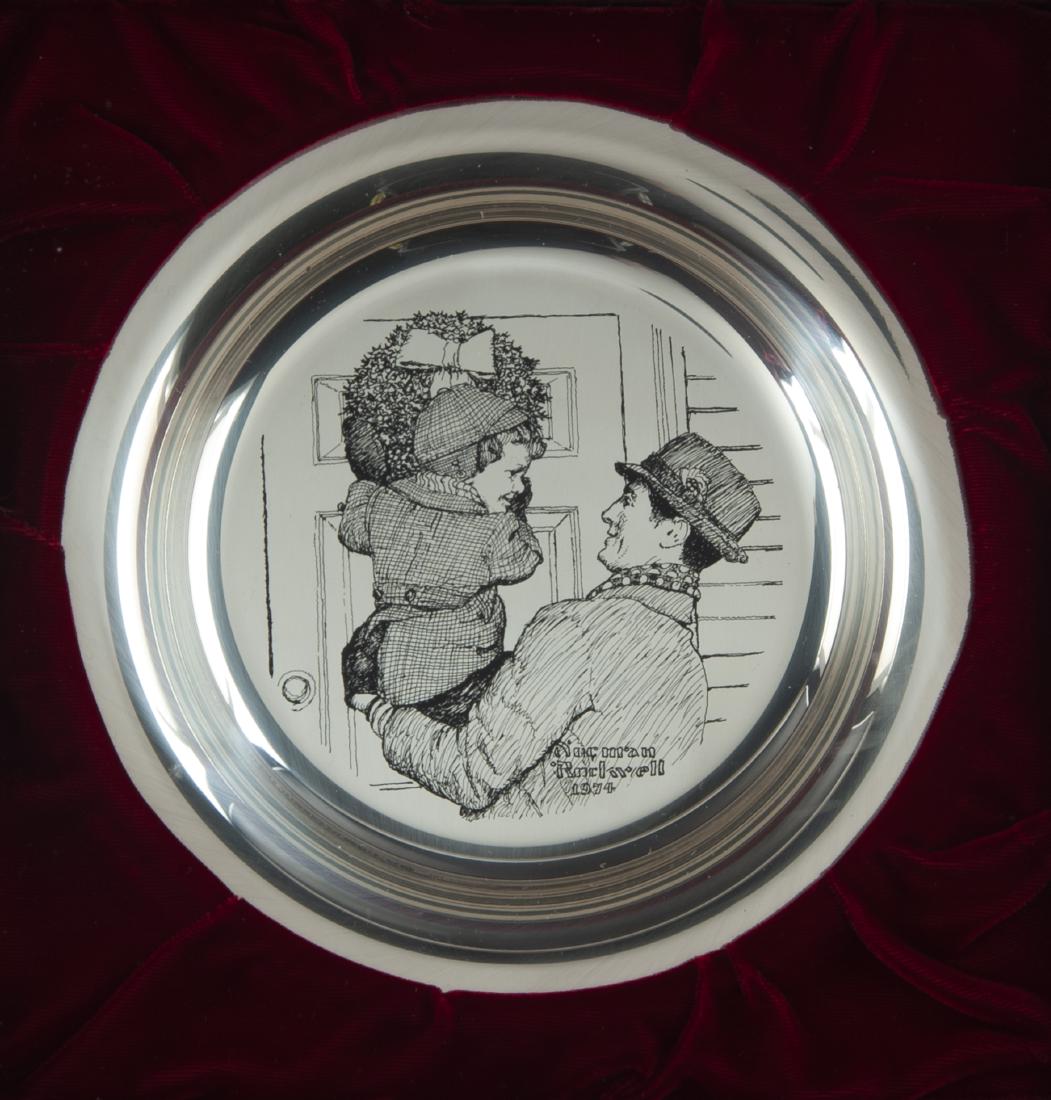 4 Normal Rockwell Sterling Silver Christmas Plates: DESCRIPTION: Four sterling silver Franklin Mint Christmas plates by Normal Rockwell in original display boxes and cases. Each with certificate of authenticity. Includes 1972 Third Annual "The Carolers