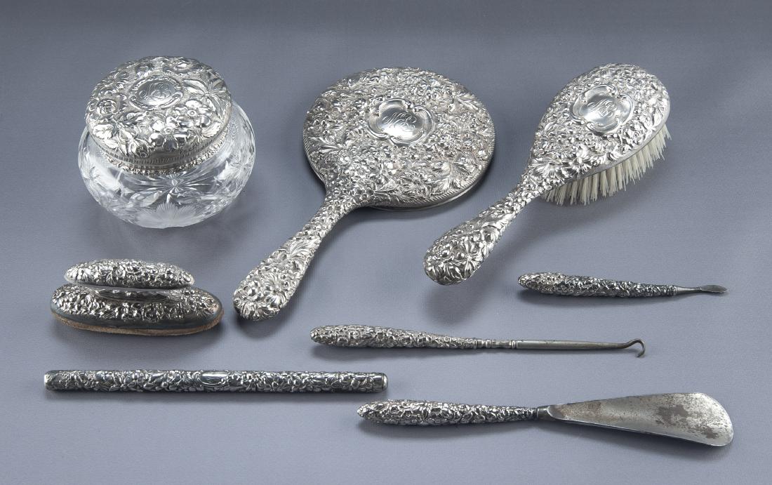 8 Pc Stieff Sterling Dresser Set: DESCRIPTION: Eight piece Kirk Stieff sterling dresser set in the Rose pattern. Monogrammed. Most pieces marked "Sterling - Stieff". Includes hand held vanity mirror, hair brush, dresser jar, button ho