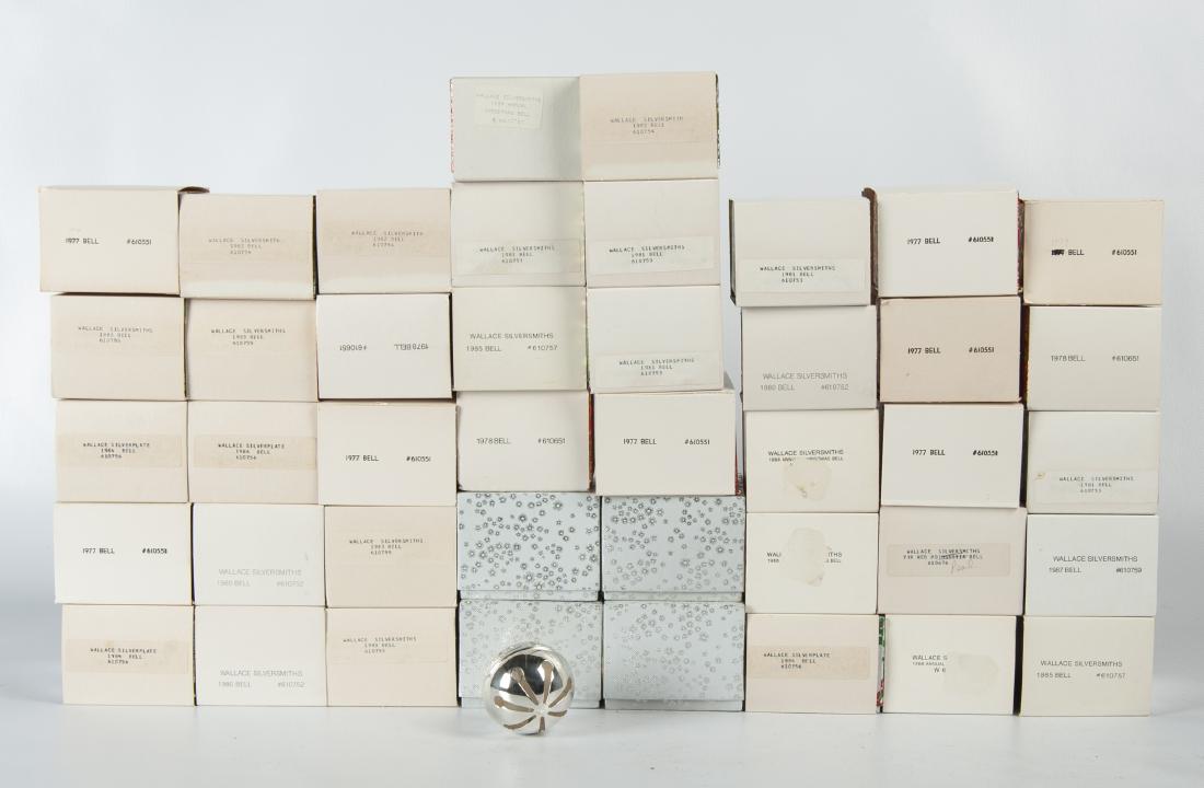 Collection of Wallace Silversmith Bells in OBs: DESCRIPTION: Collection of forty-two Wallace Silversmith silverplated Christmas bells in original boxes. Includes seven 1977 #610551, three 1978 #610651, one 1979, three 1980 #610752, five 1981 #61075