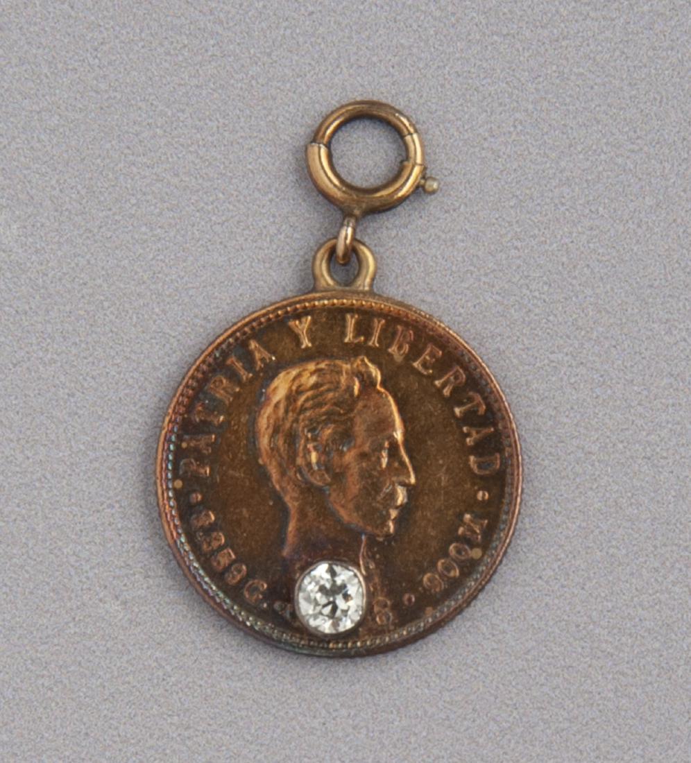 Cuban 5 Pesos Diamond Charm: DESCRIPTION: Cuban 5 Pesos gold coin set with .20 carat Old European cut diamond. Appears to be 1916 (hole through date). MEASUREMENTS: 5.5 dwt (8.5 gr). CONDITION: Light wear.