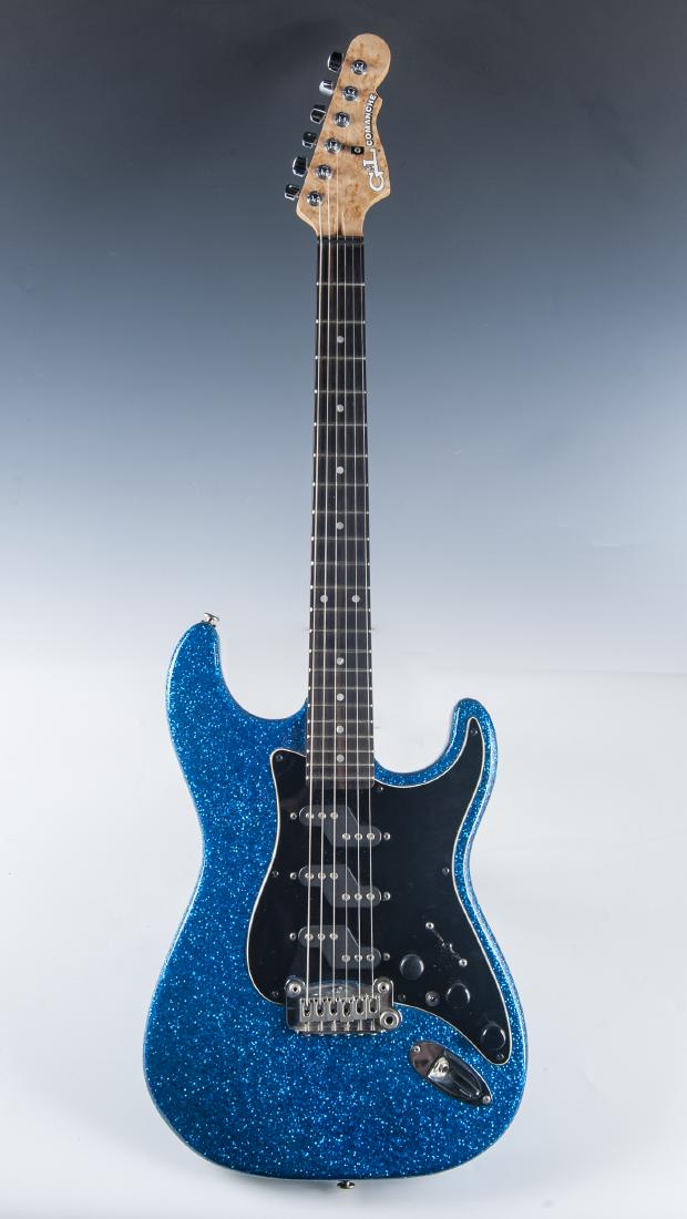 G&L Comanche Blue Metal Flake Electric Guitar: DESCRIPTION: G&L Comanche electric guitar. Blue metal flake finish with black pickguard. Bolt on construction with 22 frets, 12:1 ratio tuning keys with sealed backs, maple neck and Leo Fender-designe