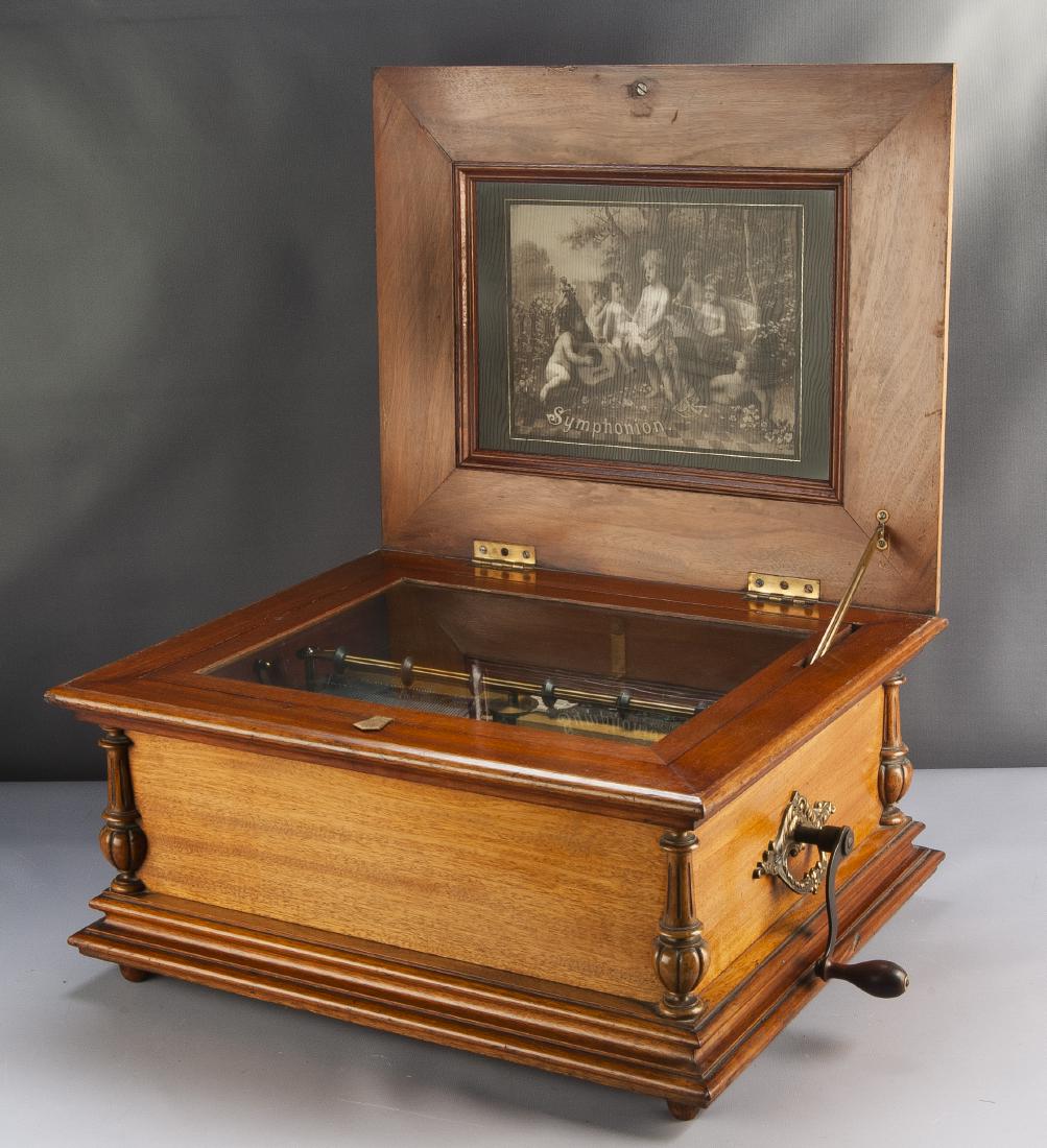 Symphonion No. 30 Disc Music Box: DESCRIPTION: Symphonion No. 30 disc music box. Circa 1900s. Walnut case with brass handles and lion's head lift ring. One hundred teeth in four music combs with sublime harmony piccolo arrangement. St