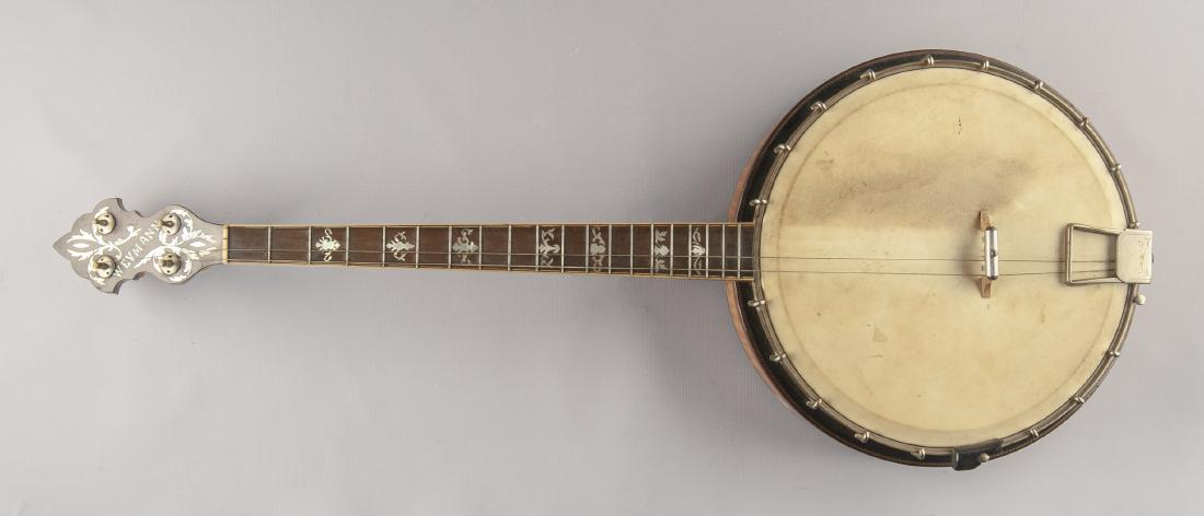 Weymann & Sons Vintage 4-String Banjo: DESCRIPTION: Weymann & Sons vintage four string tenor banjo. Circa 1920s-1930s. Bird's eye flame maple inlayed wood construction. Features 19 fret fingerboard with mother-of-pearl inlay. Peghead with 