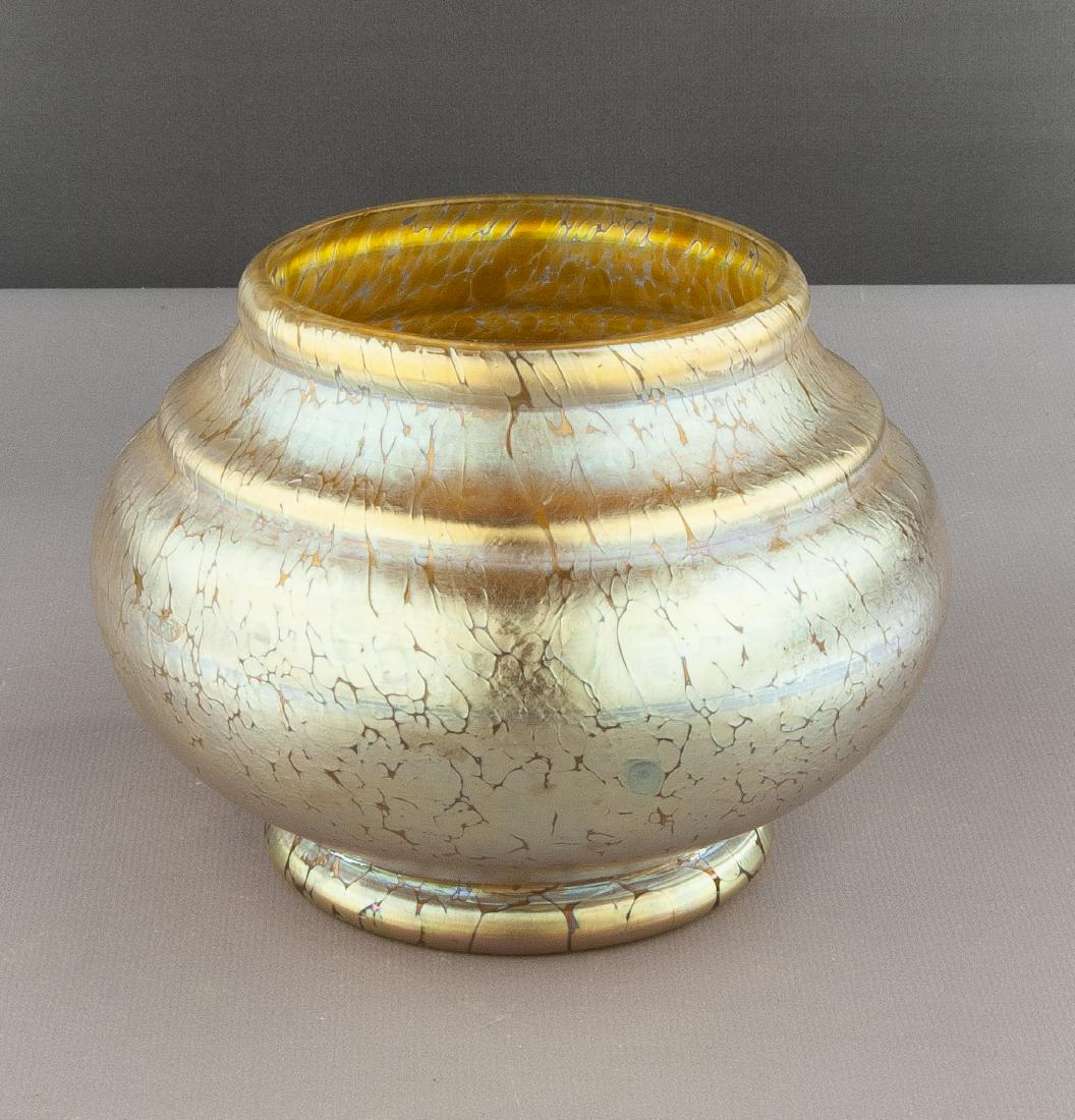 Loetz Type Oil Spot Art Glass Vase: DESCRIPTION: Loetz type iridescent yellow oil spot art glass vase. Squat form with rolled rim. Unmarked. MEASUREMENTS: 5" high x 7" diameter at widest point. CONDITION: No defects noted.