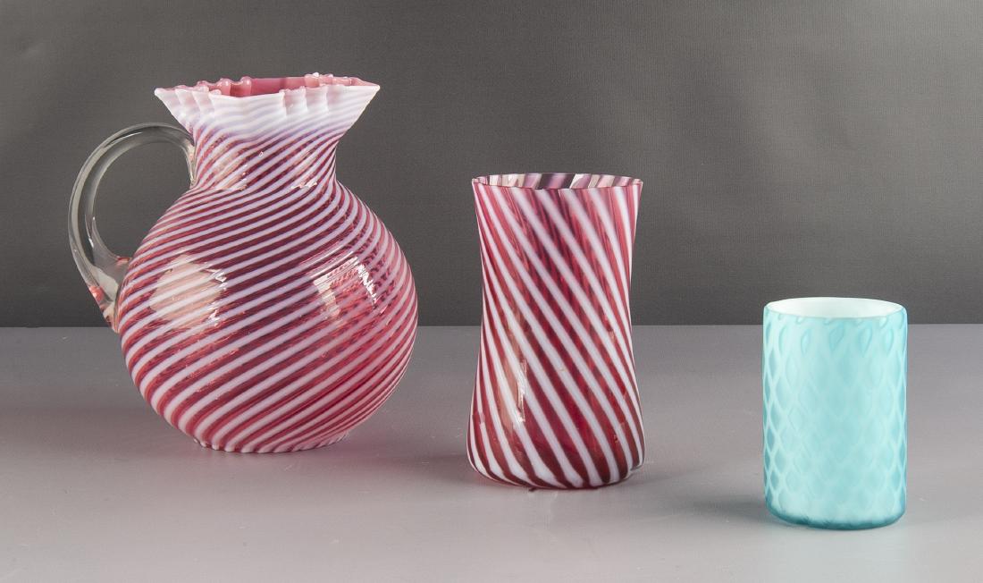 3 Pcs Victorian Art Glass Incl Pitcher: DESCRIPTION: Three pieces Victorian art glass. Includes 8-3/4" cranberry and swirl water pitcher with applied scroll handle and square crinkle rim, 6-1/2" cranberry and swirl vase, and 4-1/4" frosted 