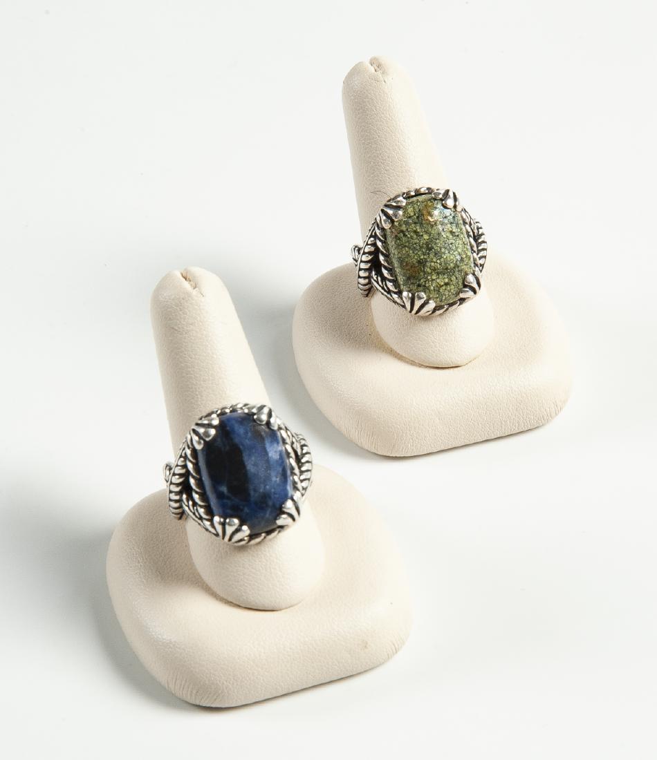 2 Sterling and Hardstone Rings: DESCRIPTION: Two sterling and hardstone rings marked 925 and CP in script, one agate, one lapis. MEASUREMENTS: 3/4" x 1/2", both size 8. CONDITION: Very light wear.