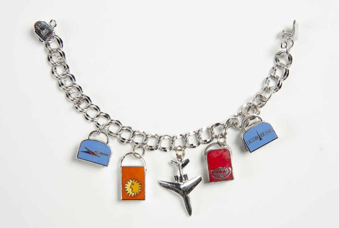 Vintage Sterling Air Lines Charm Bracelet: DESCRIPTION: Sterling air lines charm bracelet with 15 charms. Marked "Elco Sterling". MEASUREMENTS: 7" long. CONDITION: Very light wear.
