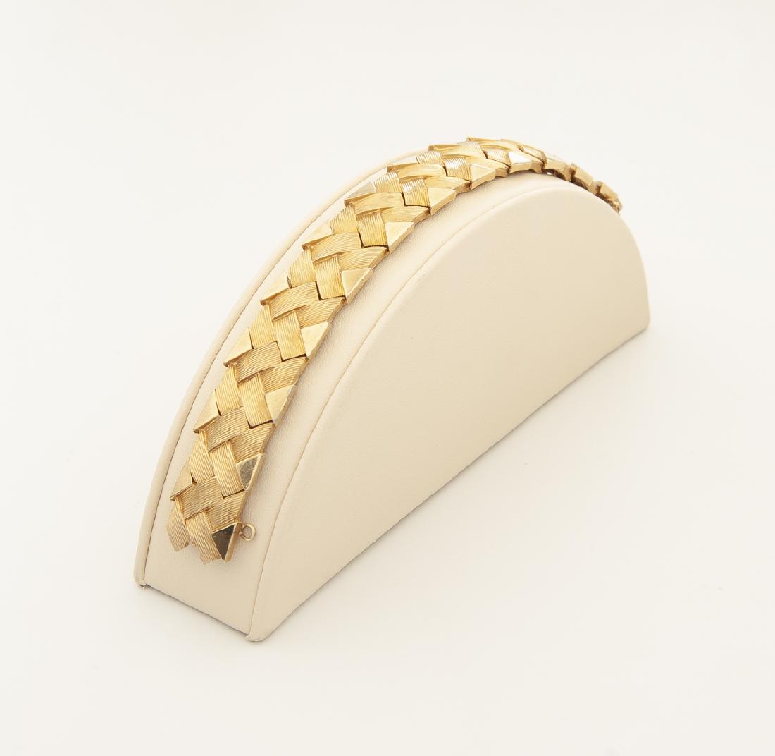 Boucher Bracelet: DESCRIPTION: Signed Boucher bracelet with safety chain. MEASUREMENTS: Approx. 2" diameter, 5/8" wide. CONDITION: No defects noted.