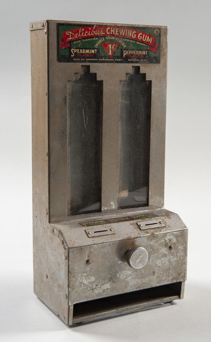 Coin-Operated Chewing Gum Dispenser: DESCRIPTION: Coin-operated chewing gum vendor or dispenser. Sold by American Merchandise Corp. of Newark, N.J. Labeled for spearmint flavor that "Aids Digestion" and peppermint flavor that "Sweetens B