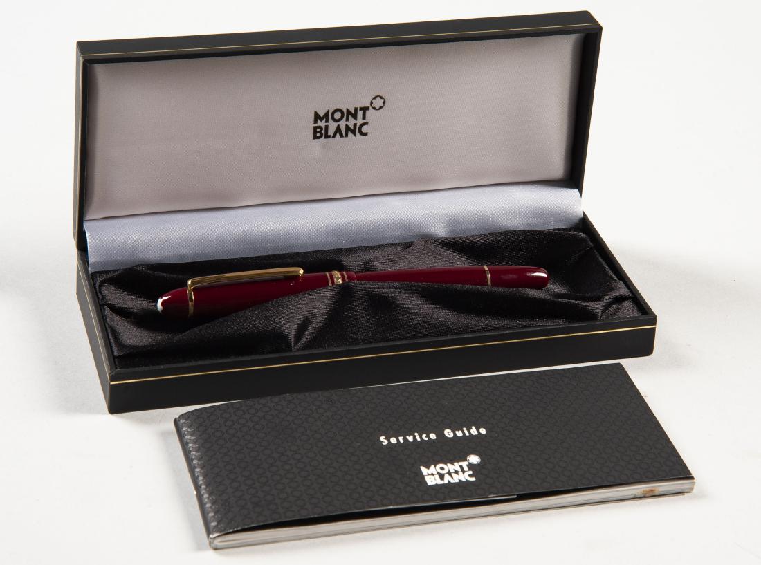 Mont Blanc Meisterstuck Rollerball Pen: DESCRIPTION: Mont Blanc Meisterstuck rollerball pen with burgundy and gold colored resin case. In original box and case with service guide. MEASUREMENTS: 5-3/4" long. CONDITION: Very good. Minor shelf