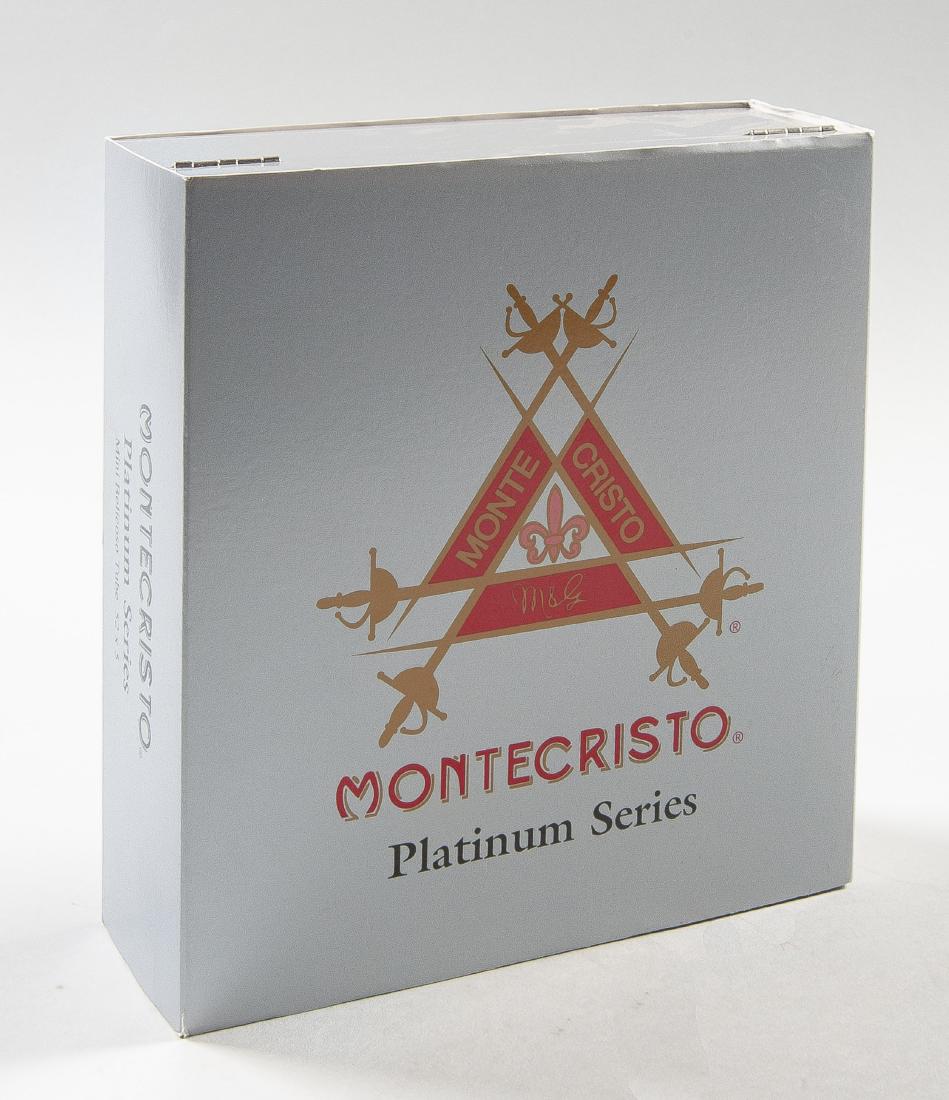 Limited Edition Montecristo Platinum Series Cigars: DESCRIPTION: Limited Edition silver lacquered box of Montecristo Platinum Series cigars. Artwork titled "Twilight of Havana", by French artist Michel Delacroix, on top and inside of lid. In original p