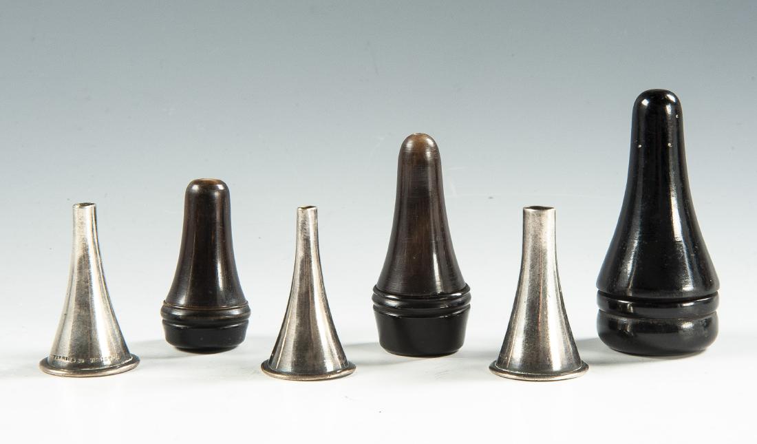 3 Otoscopic Specula: DESCRIPTION: Three otoscopic specula sets, each in case. Includes: 1) Horn case with three gold washed silver Sharp & Sims (small). 2) Horn case with three unmarked (medium). 3) Ebony case with three