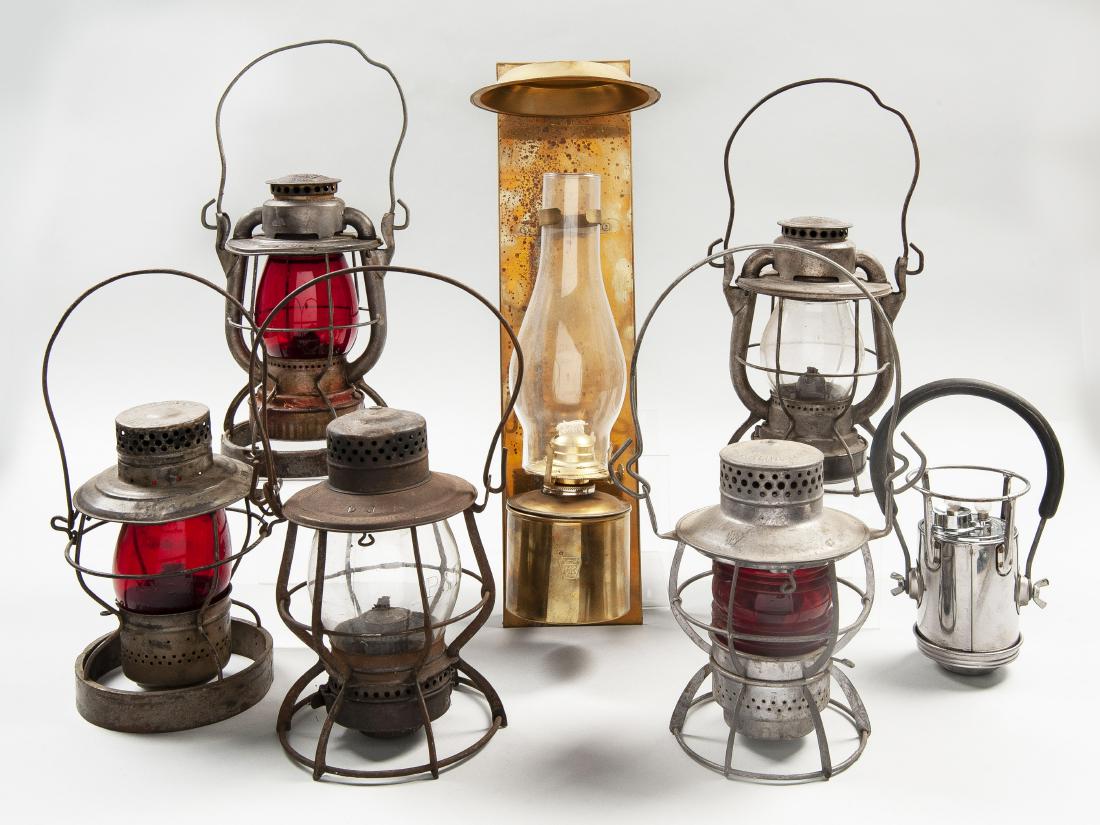 8 Railroad Lanterns Incl Dietz, Dressel & Handlan: DESCRIPTION: Eight train lanterns. Kerosene fueled lanterns include two Dietz, one Dressel, one Keystone Lantern Co., one Handlan, and one wall mounted unmarked Handlan caboose lantern. Electric lante
