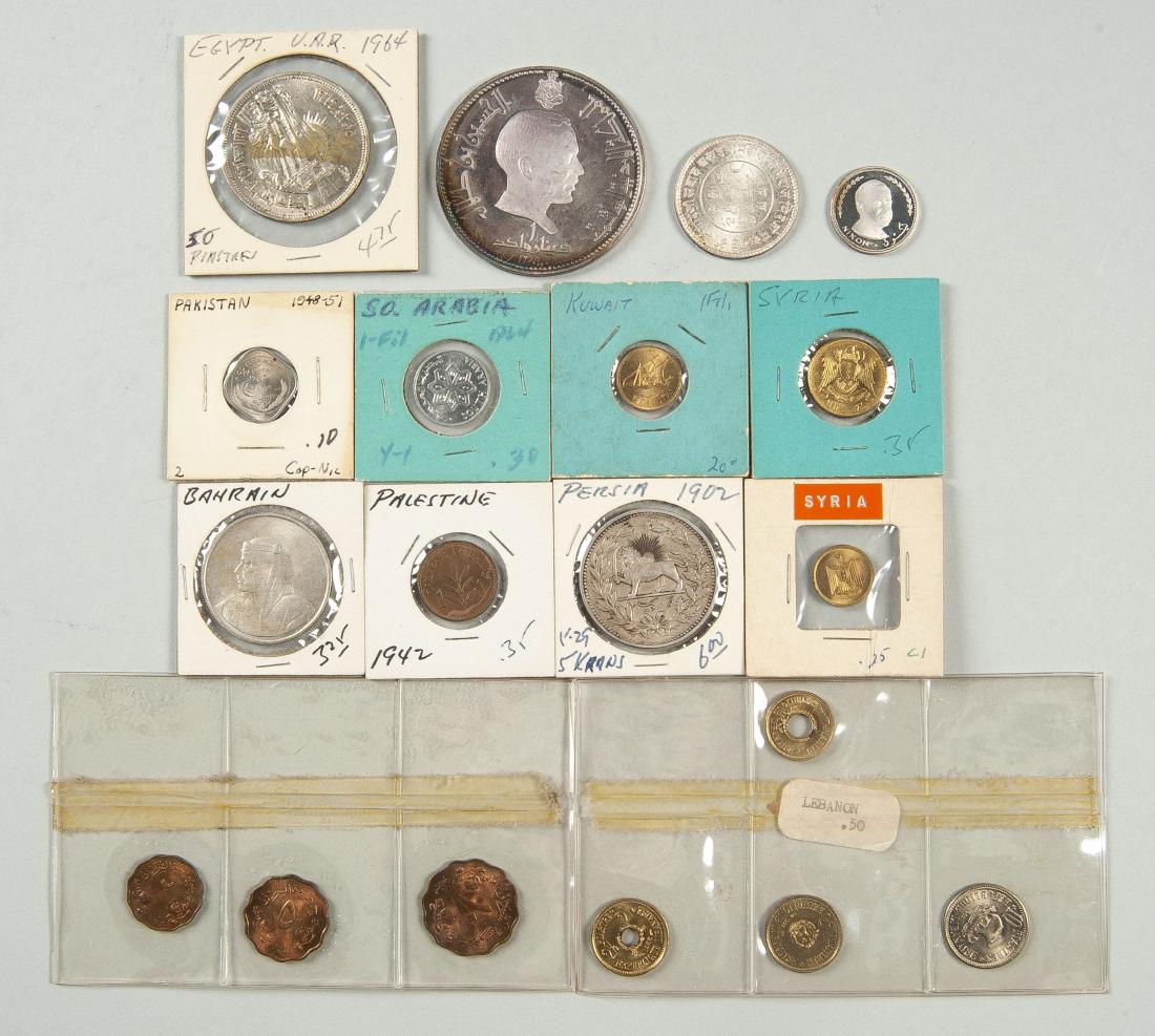19 Middle Eastern Coins incl Silver: DESCRIPTION: Nineteen Middle Eastern coins. Includes: One Fujarah, two Riyal silver unc, one Jordan silver dinar unc, four Lebanon, three Sudan, and one each: India, Syria, Pakistan, Bahrain, Kuwait, 