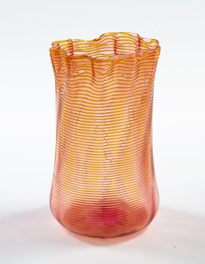 Nicholas Lutz Pink & Orange Threaded Vase: DESCRIPTION: Nicholas Lutz Boston & Sandwich Glass Co. glass vase. Pink with orange threaded design. Smooth pontil. MEASUREMENTS: 4" diameter x 6-1/2" high. CONDITION: Very good.