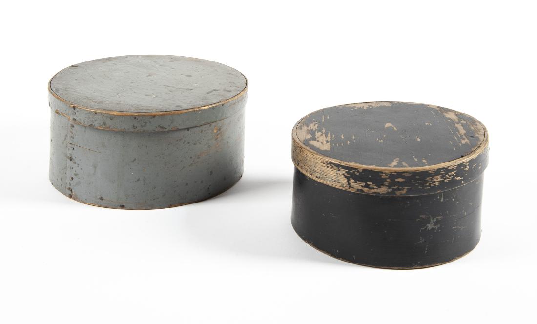 2 Round Pantry Boxes: DESCRIPTION: Two round pantry boxes. One with black paint, stamped "S. Fisk" on bottom. Other with blue-gray paint. MEASUREMENTS: 8-1/2" x 4" and 9-1/2" x 4-1/2". CONDITION: Both with losses to paint.