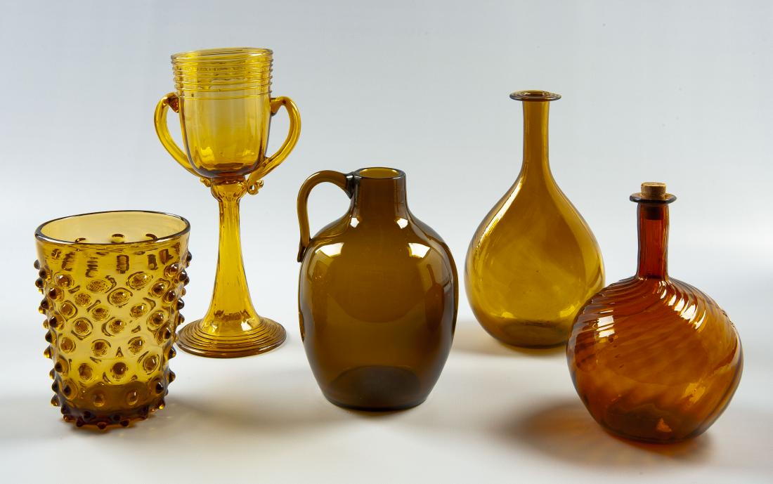 5 Pcs American Blown Amber Glass Incl Chalice: DESCRIPTION: Five pieces of American blown amber glass. Includes: 1) Hobnail vase. 4-5/8" x 5-7/8". 2) Double handled chalice. 4" x 10-1/2". 3) Jug with smooth surface, applied handle, and rough ponti