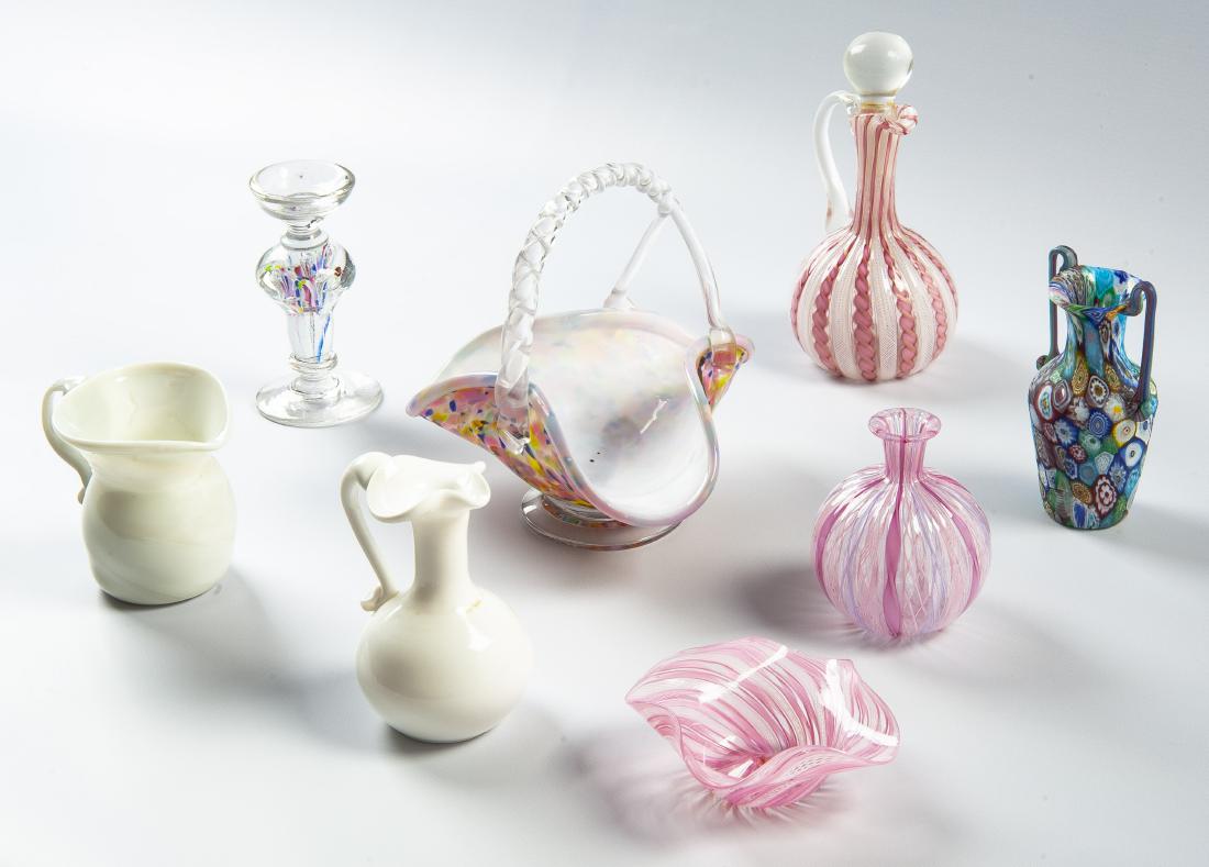 8 Pcs Blown Glass: DESCRIPTION: Eight pieces of blown glass. Includes pink lattice cruet, pink lattice bottle, pink lattice square ruffle rim dish, white pitcher, white cruet, double handled milli fiori vase, basket, an
