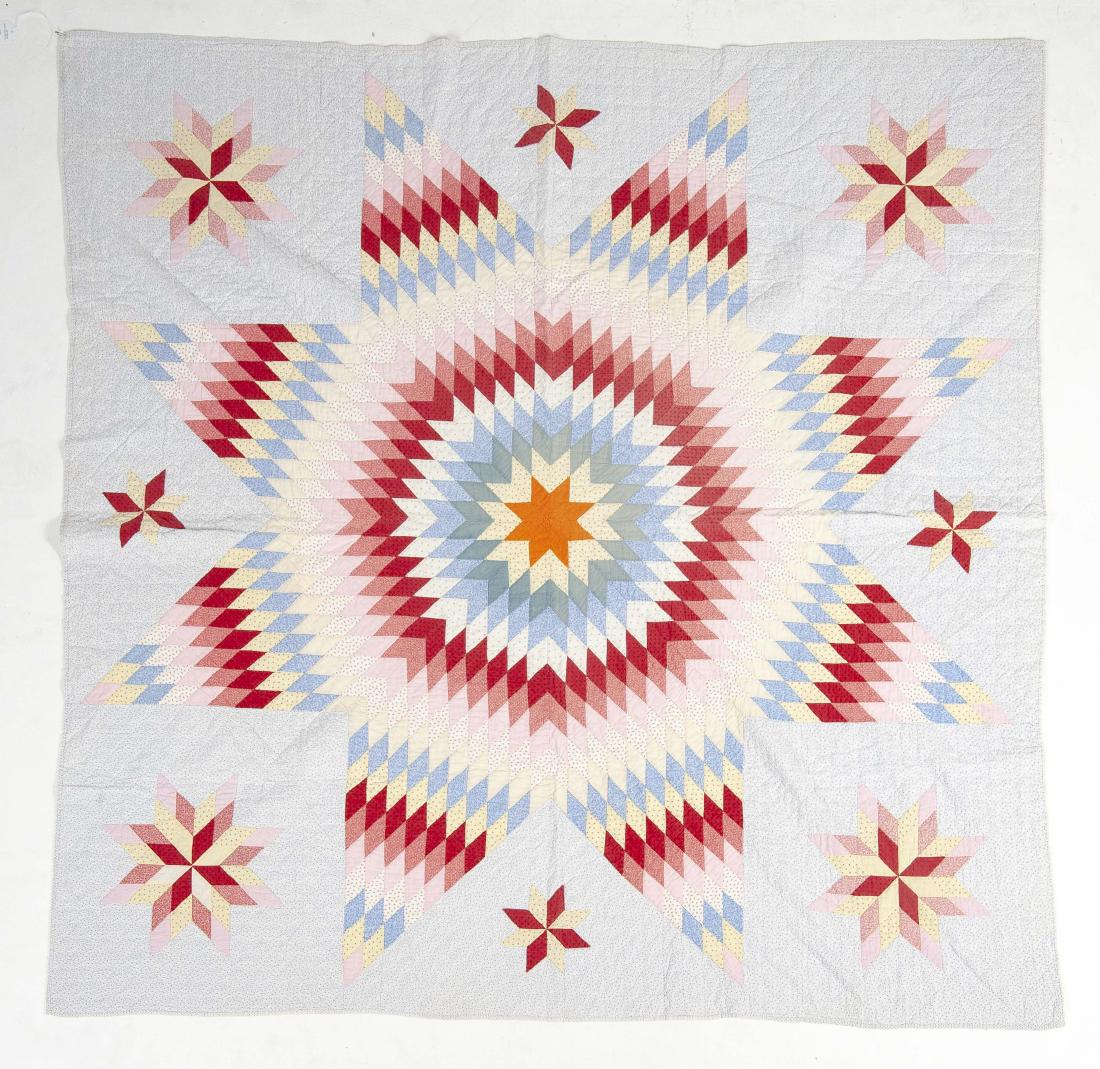 Hand Stitched Lone Star Quilt: DESCRIPTION: Hand stitched Lone Star quilt. Orange center with red, pink, and cream accent fabrics. Blue ground and backing fabric. MEASUREMENTS: 69" x 70"/ CONDITION: Light fading.