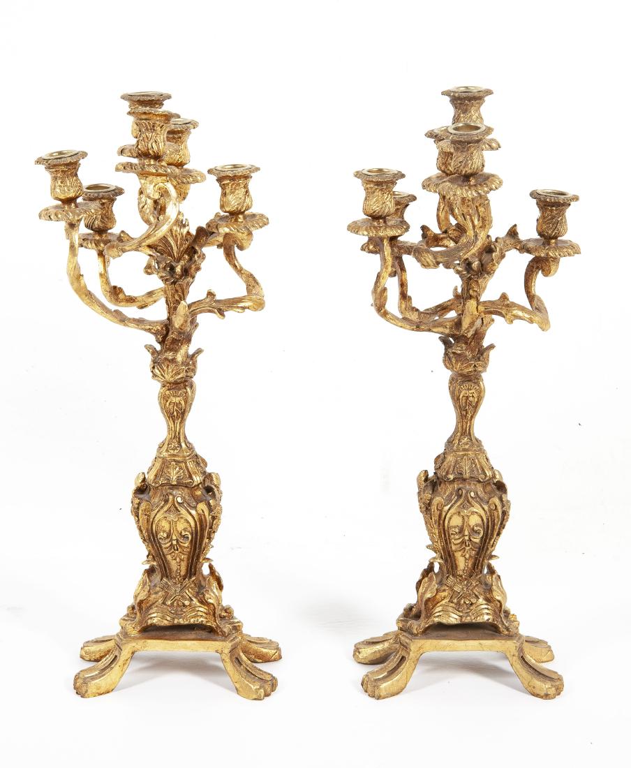 Pair of Rococo Style Candelabrum: DESCRIPTION: Pair of Rococo style candelabrum. Gilt and composition. Each with six lites and ornate leaf and scrolling design. MEASUREMENTS: Each 8" x 7" x 23". CONDITION: Good. Some cracks to composi