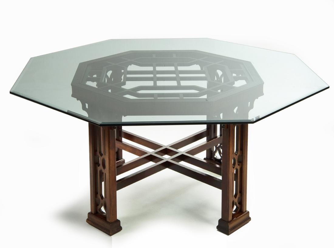 Chippendale Style Octagonal Dining Table: DESCRIPTION: Chinese Chippendale Style dining table with octagonal base and glass top. Four pairs of pierced legs with double stretchers. MEASUREMENTS: 64" long x 64" wide x 29-1/4" high. CONDITION: E