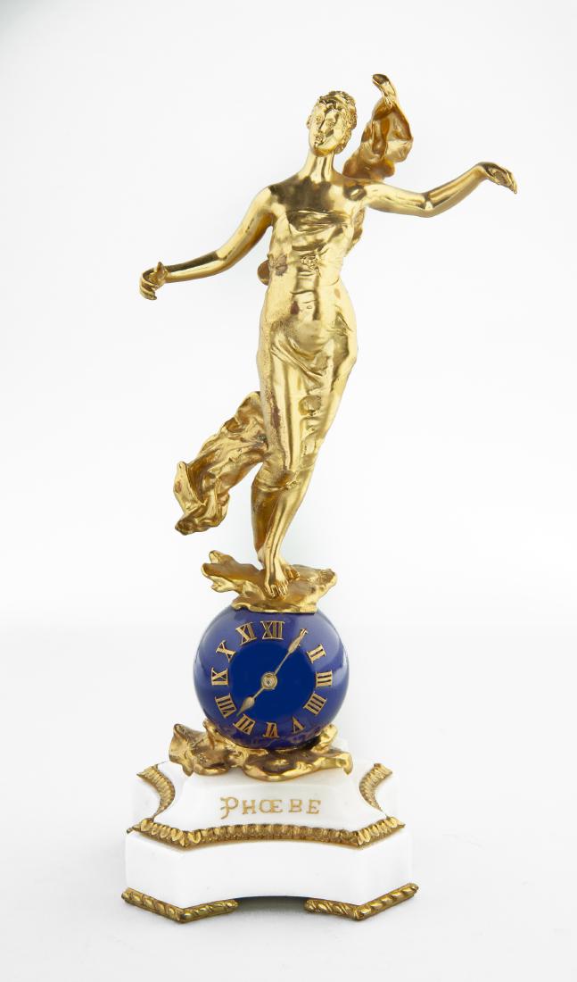 19th C "Phoebe" French Clock: DESCRIPTION: French ormolu sphere table clock, the form after Eugene Marioton (French, 1854-1925). 1889. Eight day movement housed in blue enamel sphere with balance wheel escapement. Roman numerals.
