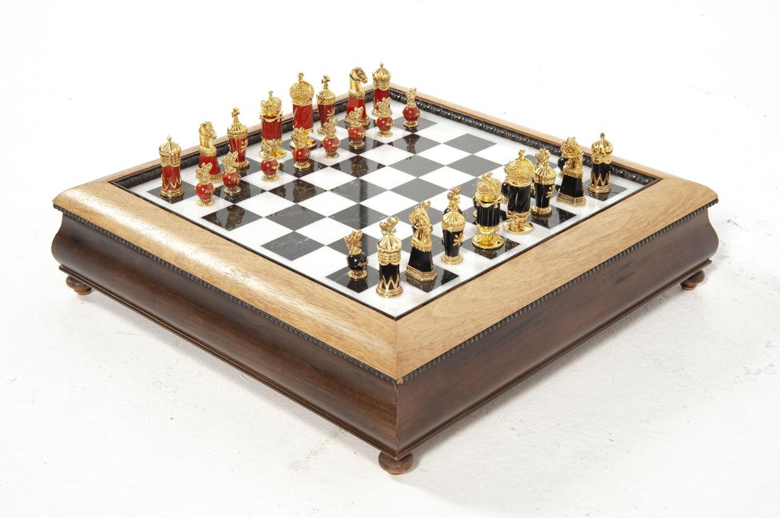 Faberge Imperial Chess Set: DESCRIPTION: Faberge Imperial chess set by Igor Carl Faberge. 20th century. Board constructed of polished marble set in rosewood. Playing pieces crafted in jasper, onyx and 24k gold vermeil set with r