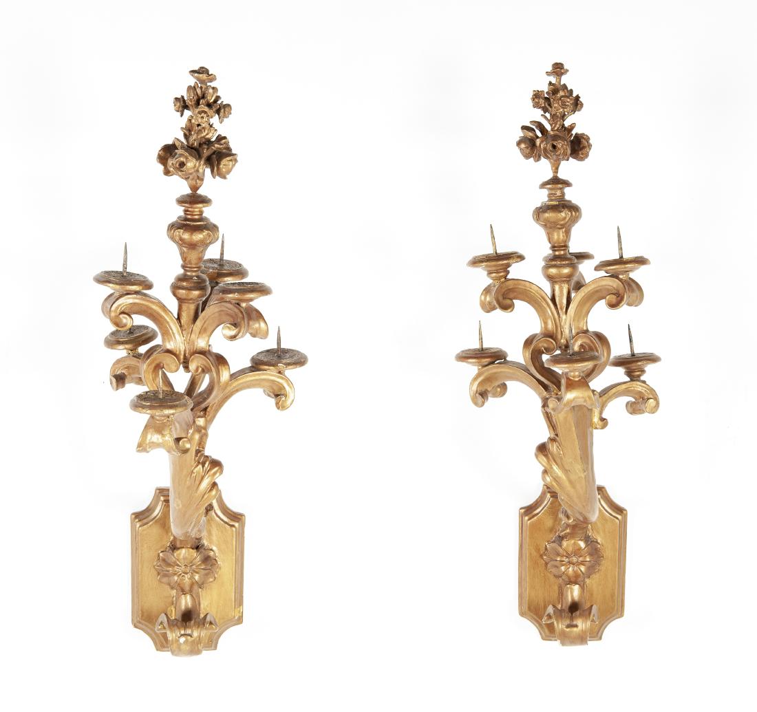 Pr Large Gilt Wood & Gesso Sconces: DESCRIPTION: Pair of large gilt wood and gesso sconces. Each with six spiked candle holders. Decorated with flowers and scrolling pattern. MEASUREMENTS: 13-1/2" x 18" x 41". CONDITION: Surface wear in