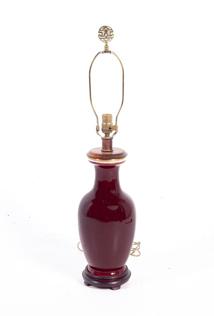Ox Blood or Flambe Vase: DESCRIPTION: Baluster form ox blood or flambe vase. Mounted as a lamp. MEASUREMENTS: Vase 8" x 15". Overall 29" high. CONDITION: Even overall crazing.