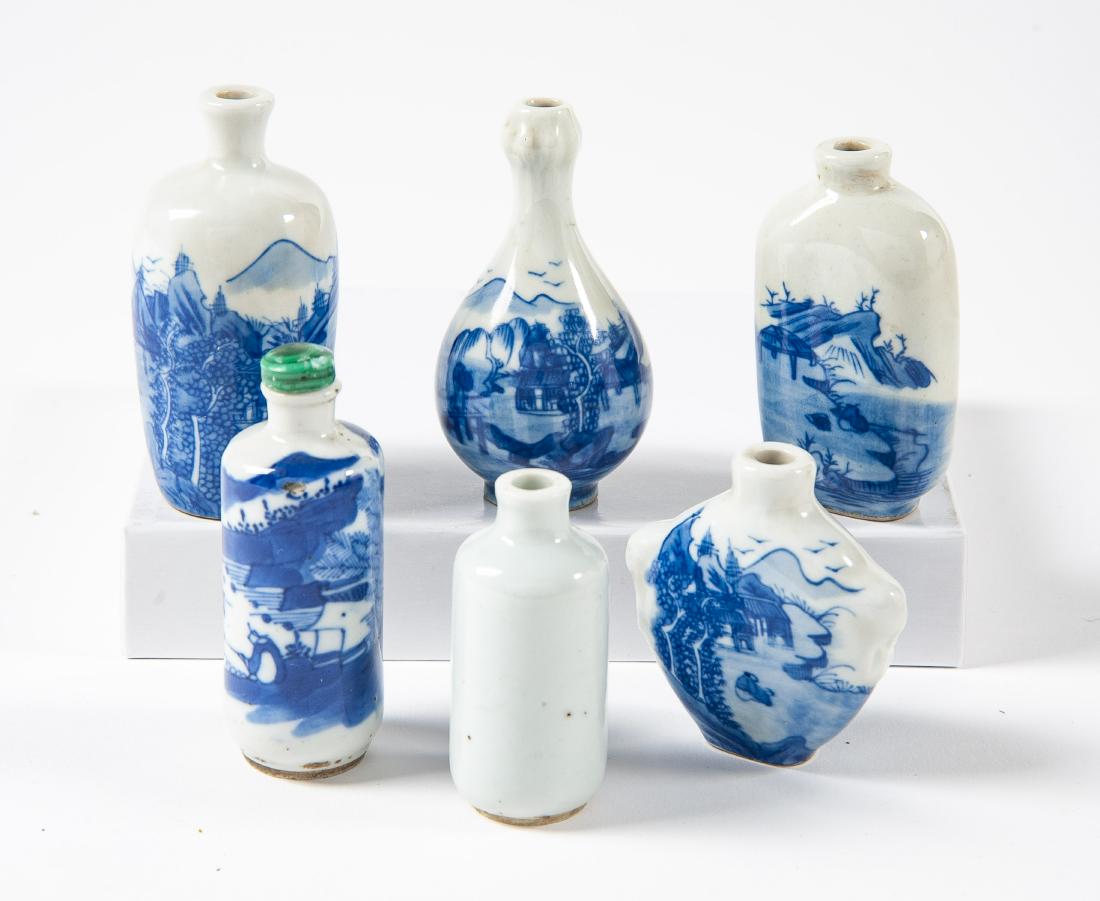 6 Blue on White Snuff Bottles: DESCRIPTION: Six blue on white snuff bottles of various forms. One with malachite lid. Four signed to bottom. MEASUREMENTS: Various. Ranges from 2-1/4" to 3". CONDITION: No defects noted.
