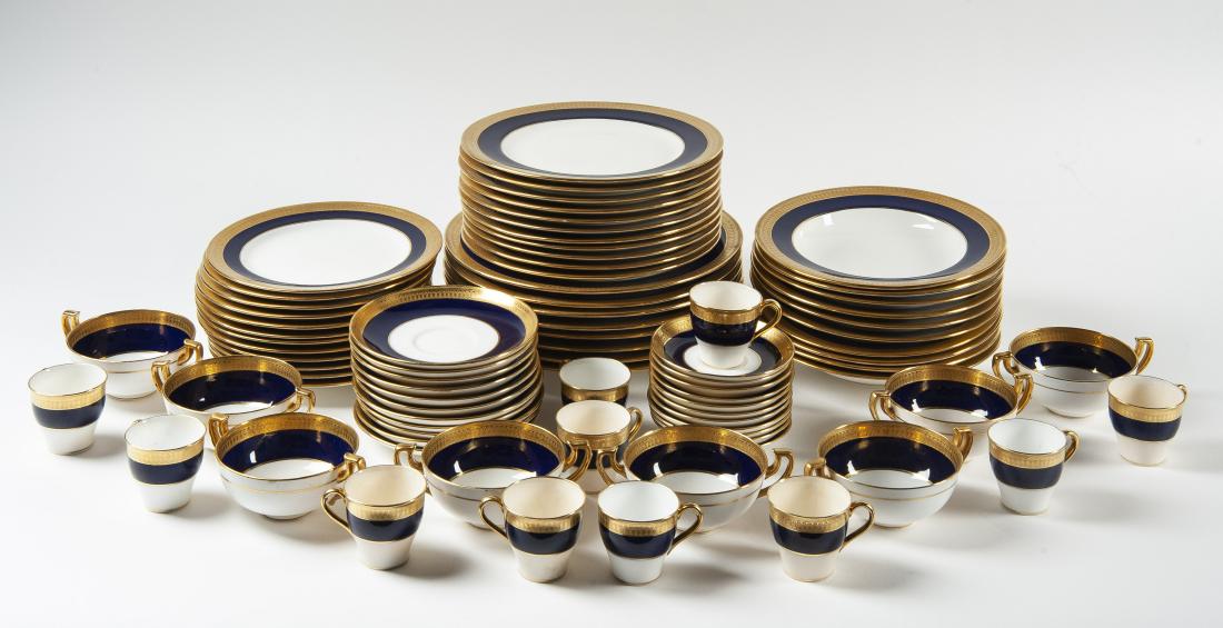 82 Pcs Mintons Dish Set: DESCRIPTION: Eighty-two piece Mintons dish set in the G6262 pattern with gold encrusted and cobalt blue band. Marked "Mintons England". Includes eight 10-1/4" dinner plates, eleven 8-7/8" luncheon pla