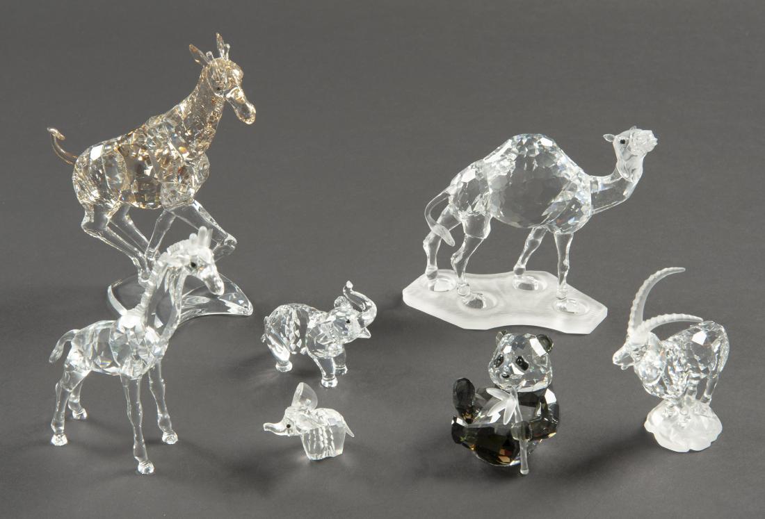 7 Swarovski African Wildlife Animals: DESCRIPTION: Seven Swarovski animals. Includes two baby elephants, Swarovski Crystal Society panda cub, camel, ibex, giraffe, and baby giraffe. Each in ob. MEASURMENTS: Ranges from 1-1/2" to 7" high. 
