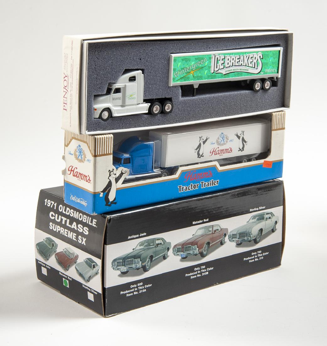 3 Die-Cast Vehicles Incl Exact Detail Olds Cutlass: DESCRIPTION: Three die-cast vehicles in original boxes. Includes 1/18 scale Exact Details 1971 Oldsmobile Cutlass Supreme SX in matador red, 1/64 scale Ertl Collectibles Hamm's Beer tractor trailer, a