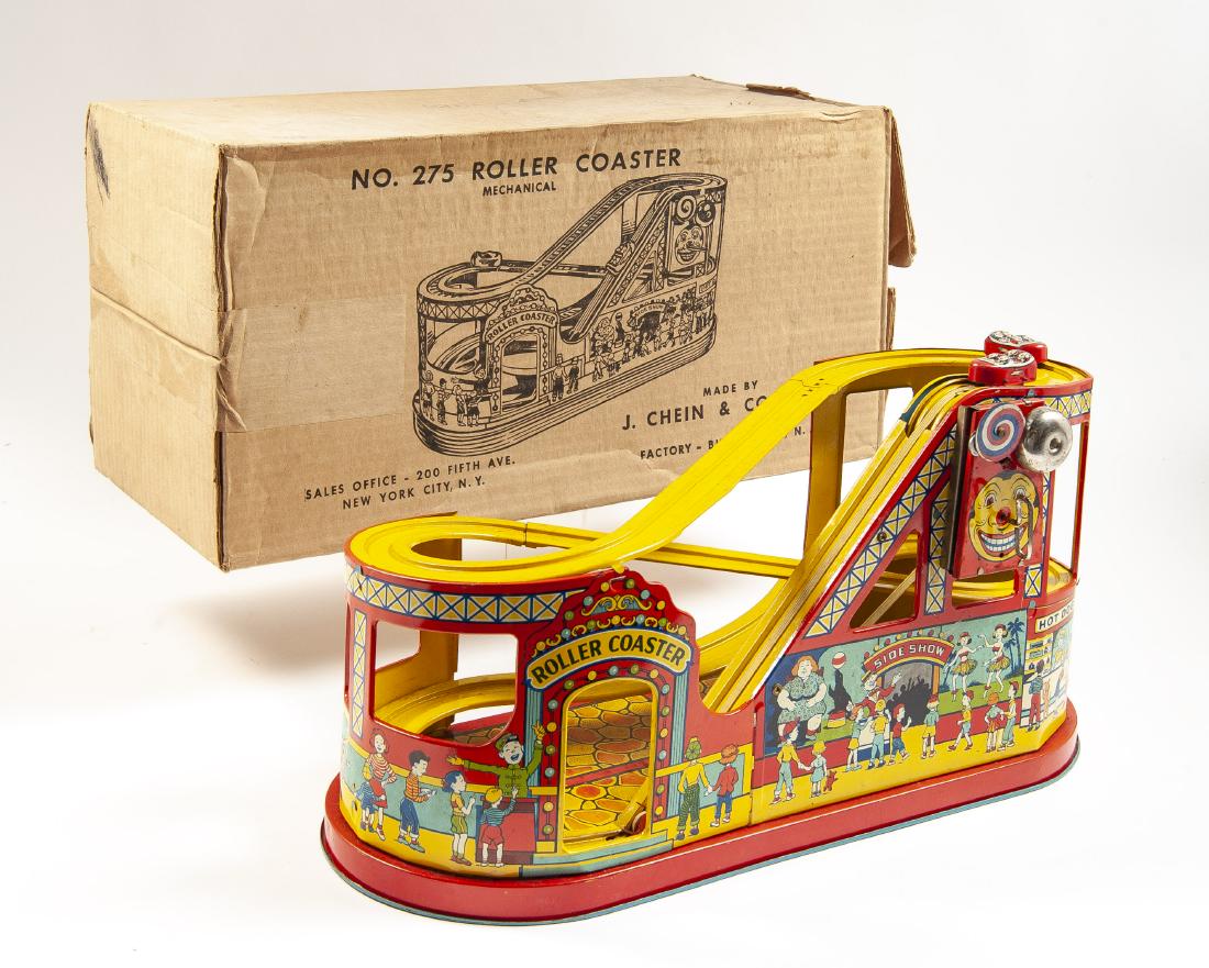 J Chein No. 275 Roller Coaster with Cars in OB: DESCRIPTION: J Chein no. 275 tin litho roller coaster wind up toy with two cars in original box. MEASUREMENTS: Box 20" x 10" x 10-1/4". CONDITION: Surface wear includes scratching and scuffs to tin. S