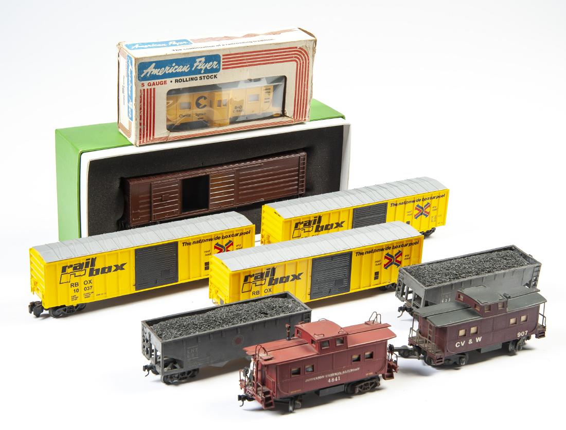 9 Pcs S Scale Rolling Stock incl American Flyer: DESCRIPTION: Nine pieces S scale rolling stock. Some in original boxes. Includes 13500 Milwaukee boxcar by River Raisin in OB, 632 and 633 Lehigh New England hoppers, three American Flyer cabooses inc