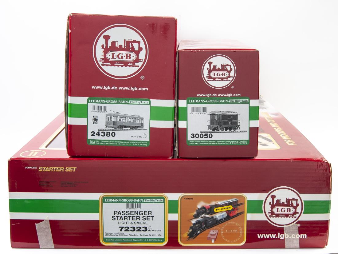 3 LGB Big Trains in OBs: DESCRIPTION: Three LGB Big Trains in original boxes. Includes 72323 Pennsylvania Passenger starter kit, 30050 and 24380. MEASUREMENTS: G scale. CONDITION: Appears complete in original box. Box with we