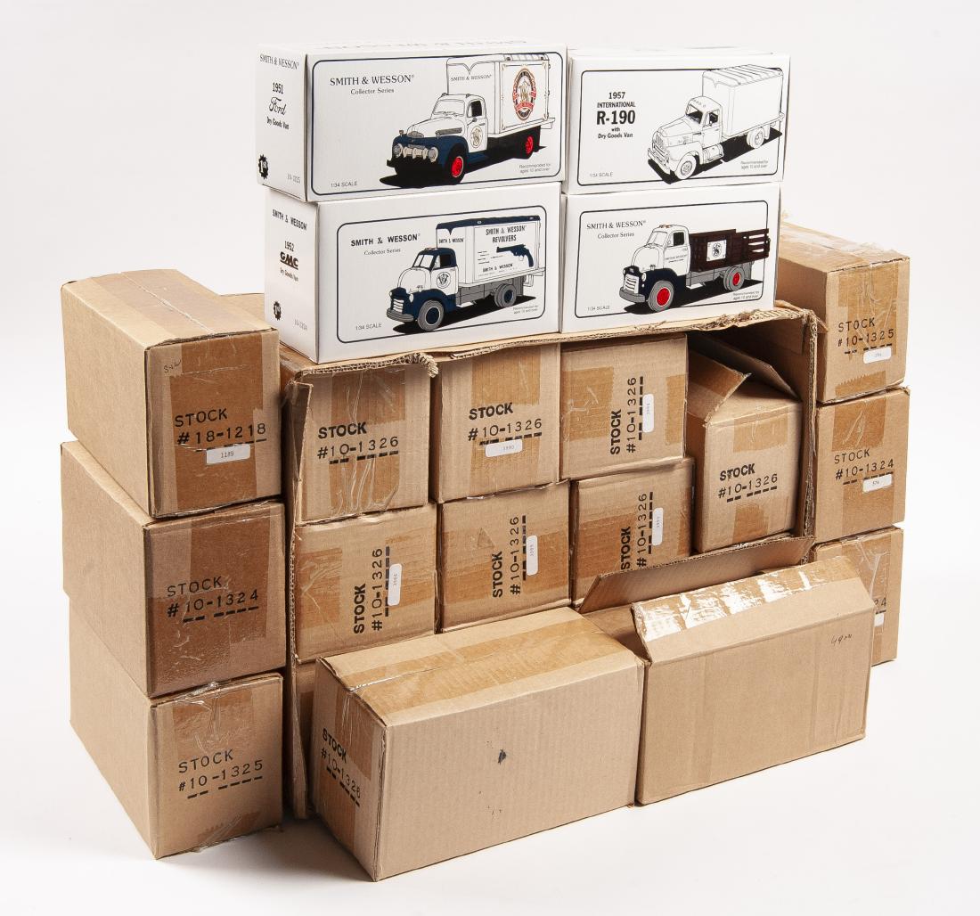 23 First Gear Die-Cast Metal Replicas in OBs: DESCRIPTION: Twenty-tree First Gear Smith & Wesson die-cast metal replica van and truck models in original boxes and shipping cartons. Includes two #18-1218 1957 International R-190 with dry goods van