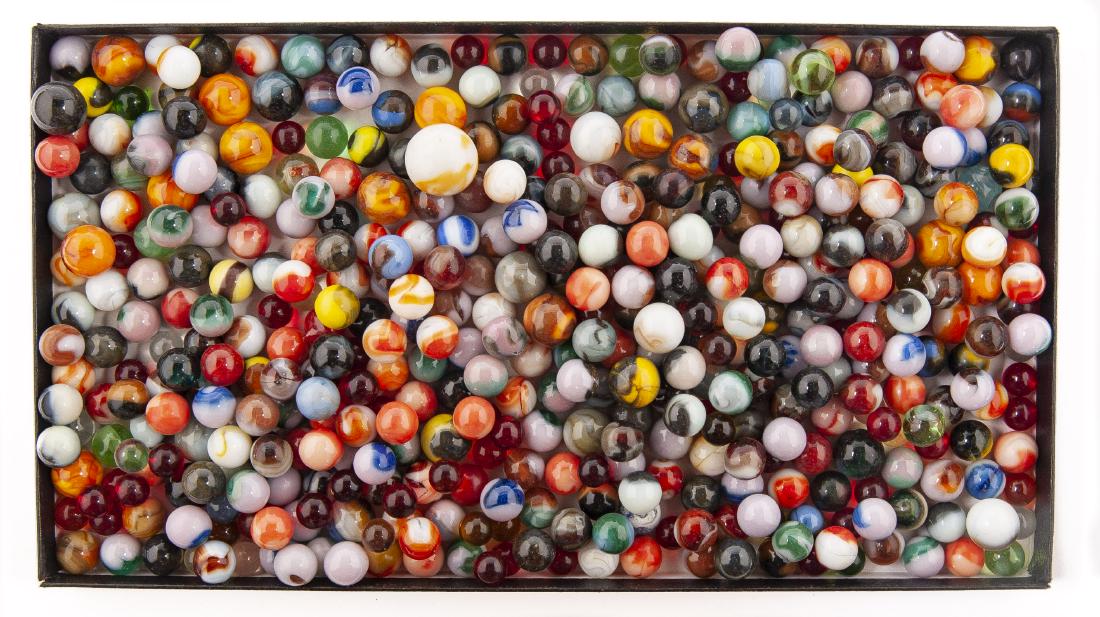456 Hand and Machine Made Marbles: DESCRIPTION: 456 handmade and machine made marbles. Includes swirls, akro, vitro, slags, striped, patches, agates, clay, and more. MEASUREMENTS: Range from 1/3" to 1/2". CONDITON: Older marbles bruise