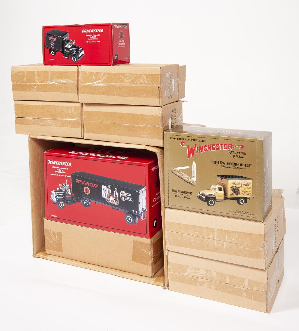 12 Winchester Diecast Vehicles incl Centennial: DESCRIPTION: Twelve Winchester First Gear diecast vehicles. Includes: 1) Five 1894-1994 Model 94 Special Edition 1960 Model B-61 tractor & Trailer 18-1320. 2) Two Model 1895 Commemorative sets replica