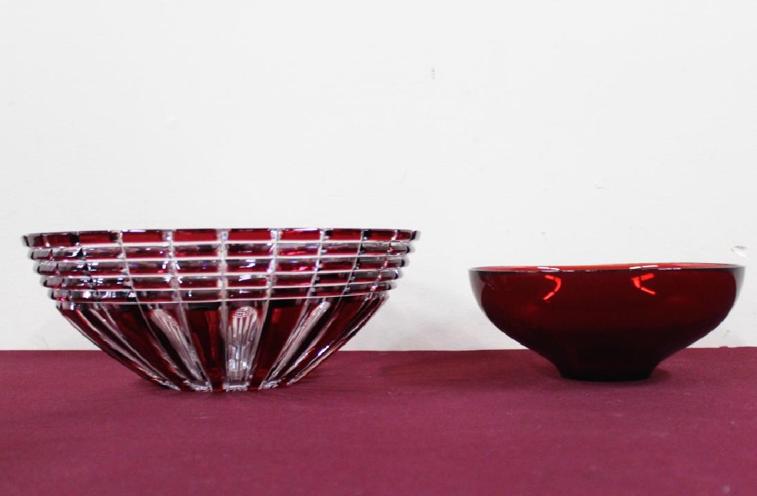 2 Glass Bowls. Orrefors+Cut to Clear: Cut to Clear MEASUREMENTS: 11" diameter 4" high. Ruby Red Orrefors MEASUREMENTS: 7-3/4" diameter 3" high